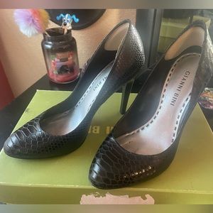Barely worn black snakeskin look pumps.